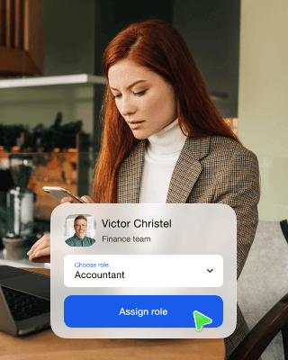 A woman assigns a role to an employee via the software