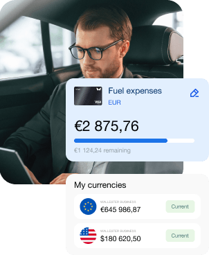 A man sits in his car and checks his fuel costs on a mobile app