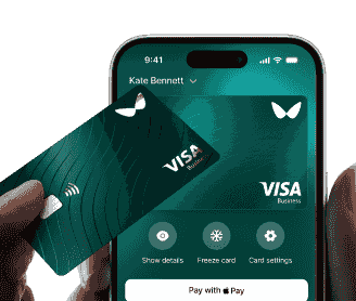 Wallester payment cards in hand: a phone with a virtual card image in one hand and a physical card in the other