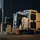 Delivery van with open doors being loaded with boxes near a warehouse