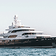 superyacht cruising on the open sea under clear skies
